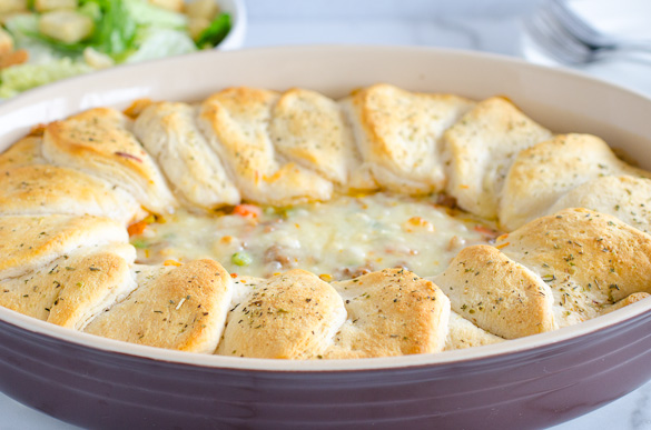 biscuit topped casserole in oval dish