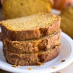 stack of pumpkin bread slices on a white plate