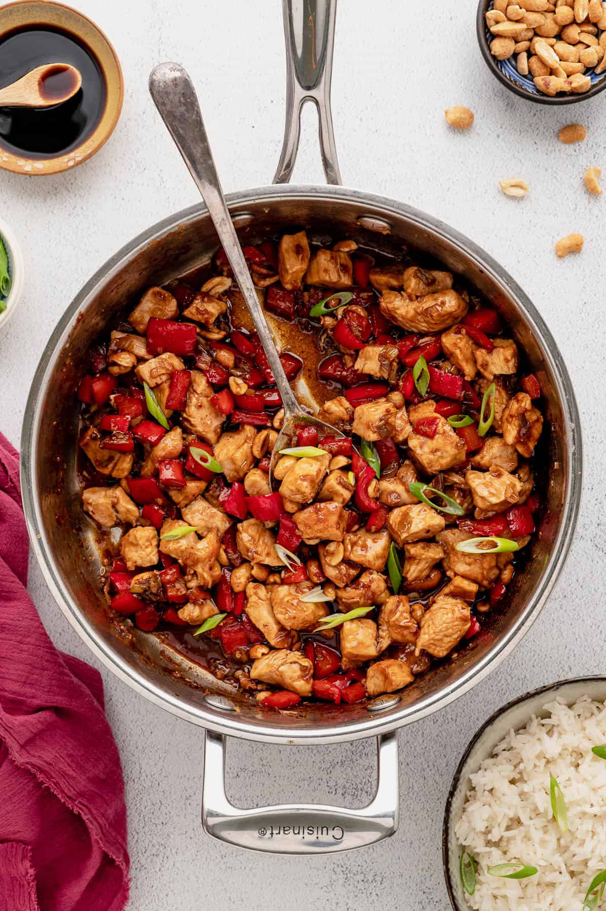 kung pao chicken in a stainless steel saute pan
