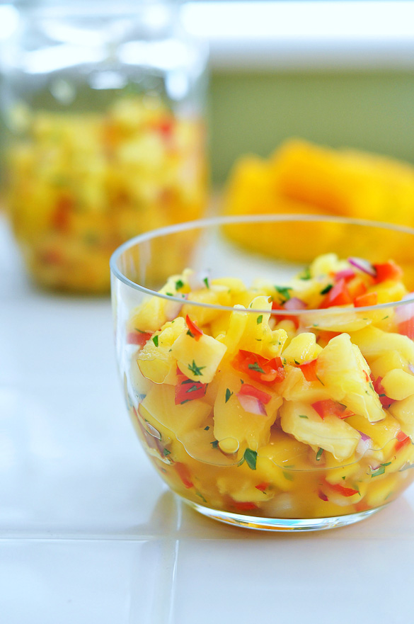 An easy Pineapple Mango Salsa recipe you can dip your chips into or use in various dishes like Pineapple Mango Pizza!  This fresh homemade pineapple salsa comes together quickly and is full of wonderful flavors!
