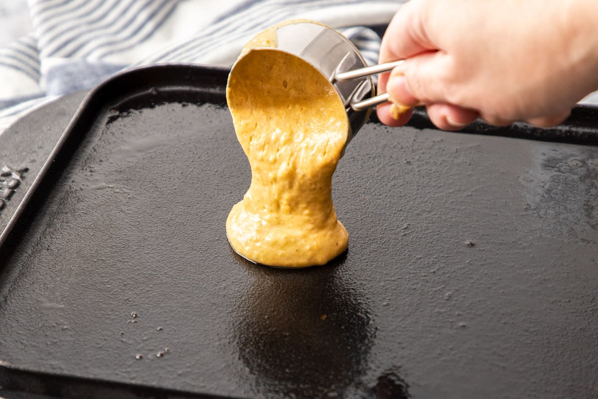 pour pumpkin pancake batter onto hot griddle