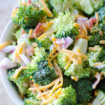 A fresh crisp broccoli salad tossed with a simple tangy homemade dressing. Broccoli salad is a quick salad everyone loves for any gathering, potluck, party, etc.