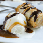 ice cream with fried egg roll and chocolate caramel sauces