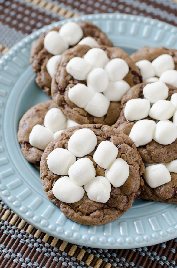 Hot Chocolate Cookies are chocolate cookies made with hot cocoa and topped with gooey mini marshmallows that puff perfectly in the oven. Warm up this winter with our favorite Hot Chocolate Cookies!