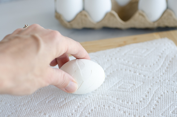 cracking egg on paper towel