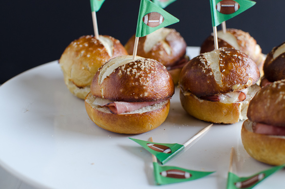 These Ham and Cheese Soft Pretzel Sliders are the perfect finger food for your tailgate party on game day. Everyone loves a good soft pretzel bun!