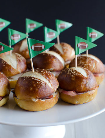 These Ham and Cheese Soft Pretzel Sliders are the perfect finger food for your tailgate party on game day. Everyone loves a good soft pretzel bun!