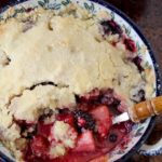 Our favorite tried and true Berry Cobbler Recipe with a crumb topping. This Favorite Berry Cobbler stands amazing on its own or is served warm with ice cream.