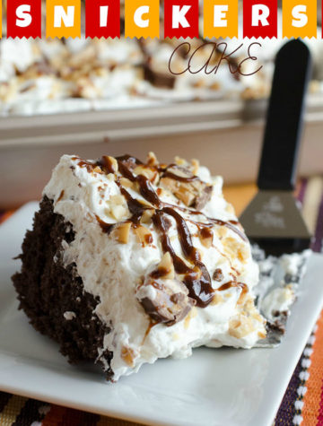 Snickers Cake is a dessert to please a crowd. Boxed cake mix is the base for this Snickers Cake that is then soaked in caramel sauce and garnished with a whipped Snickers topping.