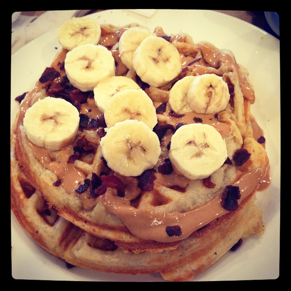 The "All Shook Up" from Anna's House in Grand Rapids, MI - Waffles topped with bananas and peanut butter, sprinkled with bacon.