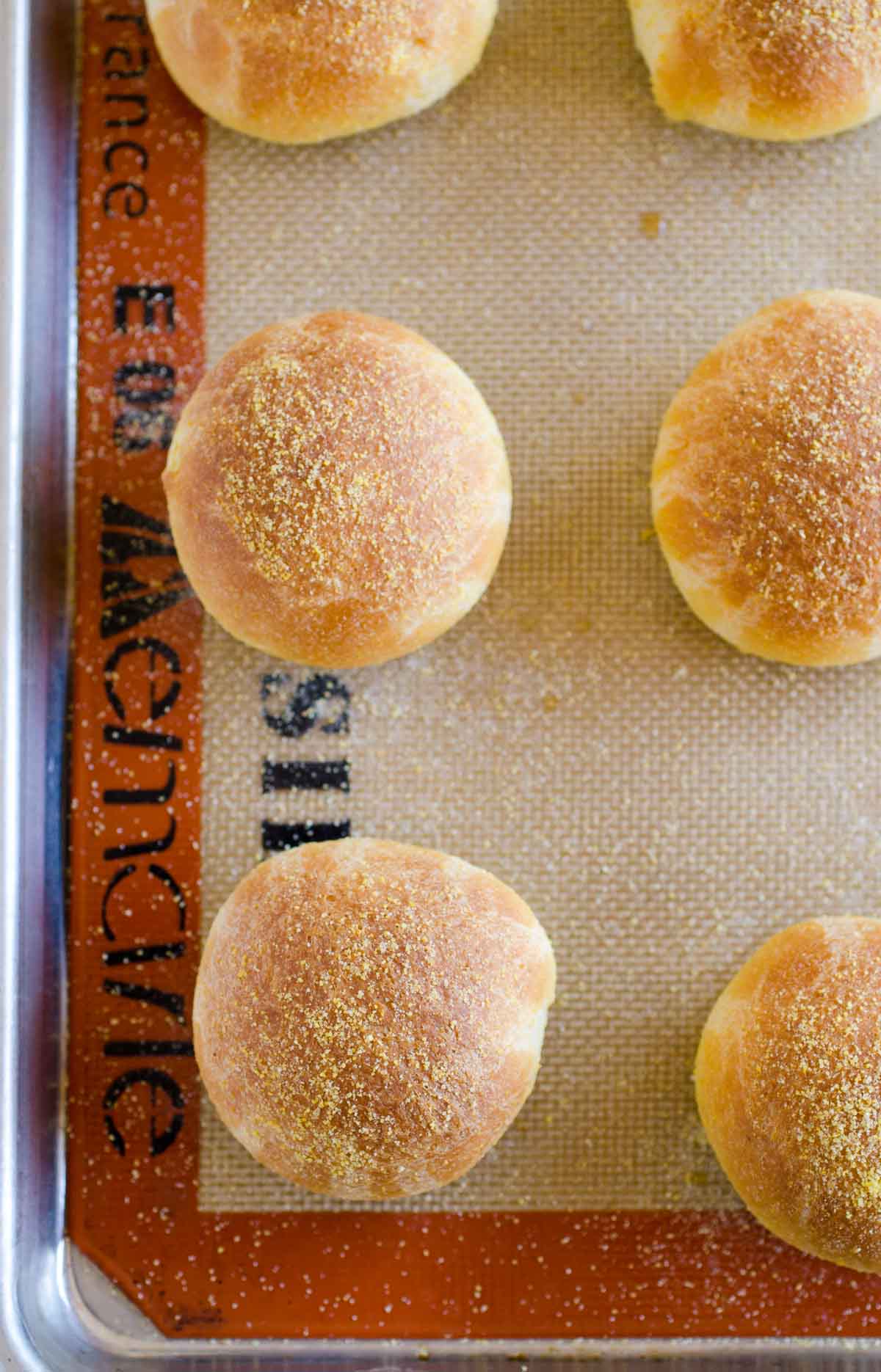 Cornbread rolls on a baking pan