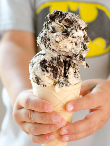 Child holding OREO ice cream cone