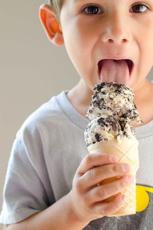 Kid licking OREO ice cream cone