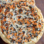 Giant Halloween Sprinkles Sugar Cookies - These giant bakery style cookies, rolled into multi-colored sprinkles, are a festive option for Halloween!