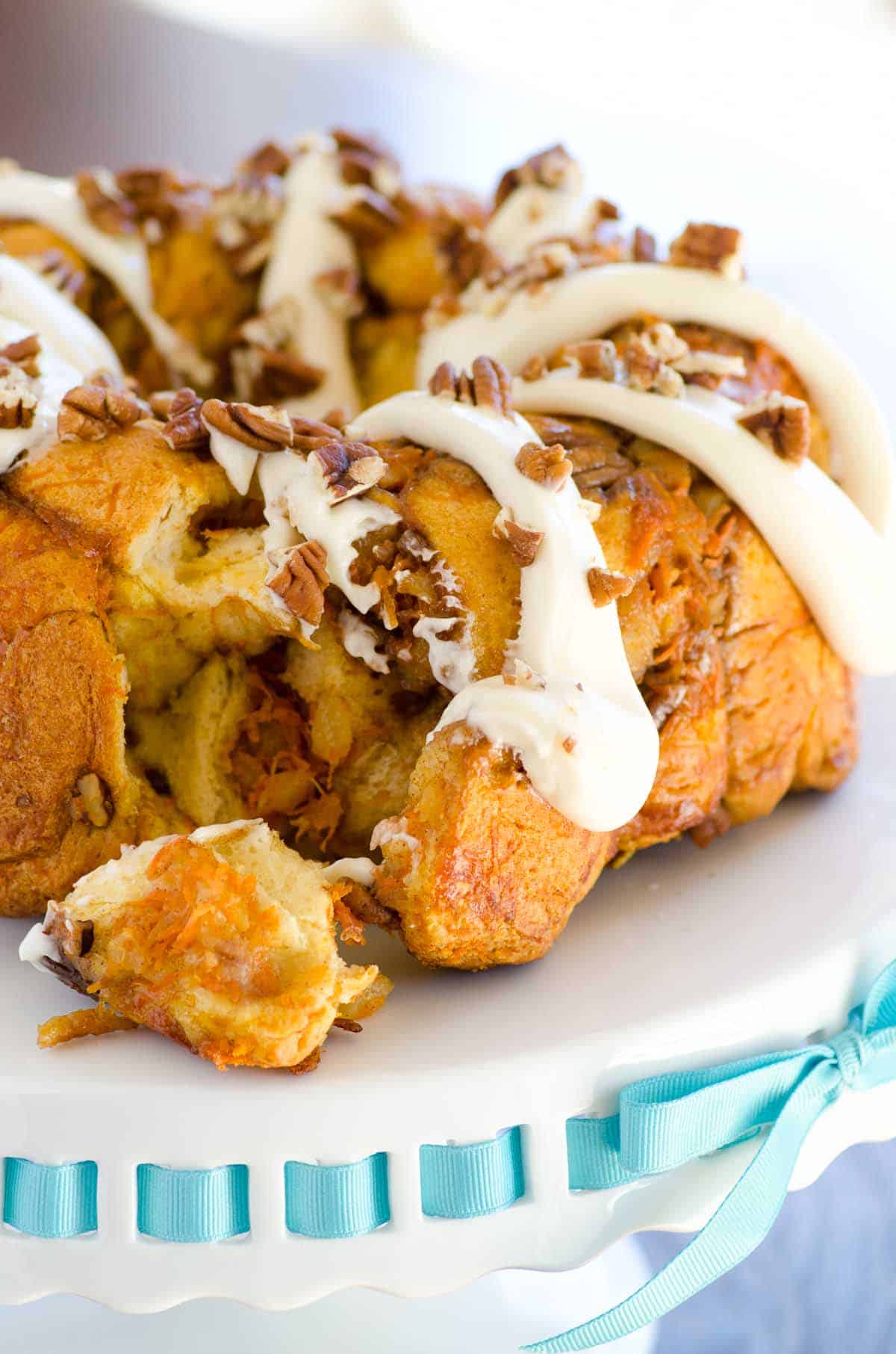 carrot cake monkey bread on a platter with blue ribbon