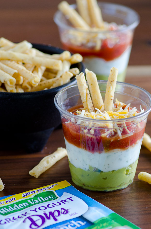 Layered Fiesta Dip with Greek Yogurt Ranch - use store-bought guacamole, salsa and Hidden Valley dry ranch mix for this very easy and convenient layered dip that's pretty, too!.