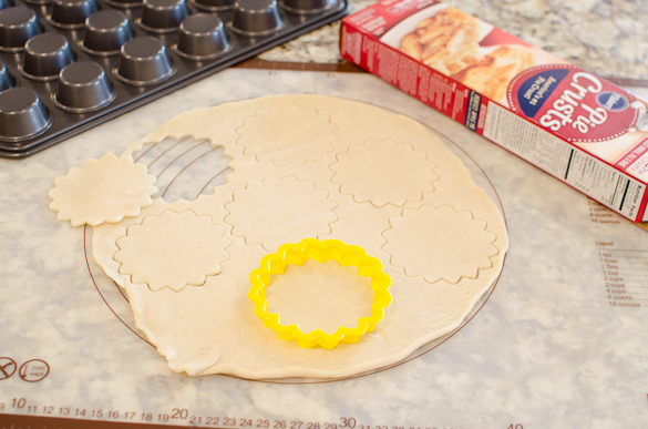 scalloped cookies cutter on refrigerated pie crust