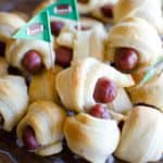stacked pigs in a blanket with football flag toothpicks