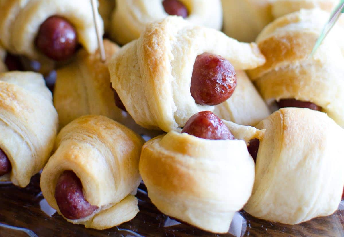 close up of stack of mini pigs in a blanket