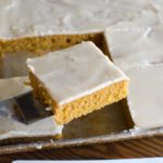 square slice of pumpkin sheet cake in pan