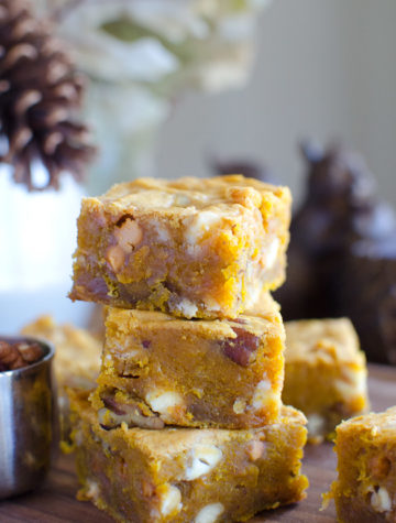A recipe for Pumpkin Blondies loaded with rich flavors of fall and a thick gooey texture. These rich sweet dessert bars are packed with white chocolate chips, butterscotch chips and pecans.
