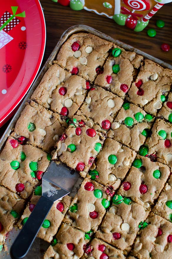 The best and easiest Christmas M&M Cookie Bars that are perfect for your Christmas cookie exchange! These gooey and chocolaty Christmas M&M Cookie Bars are loaded with red and green M&M's, chocolate chips and white chocolate chips for a festive holiday cookie treat!
