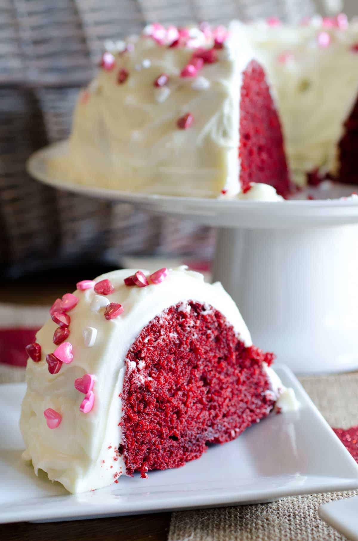 slice of red velvet bundt cake with heart sprinkles