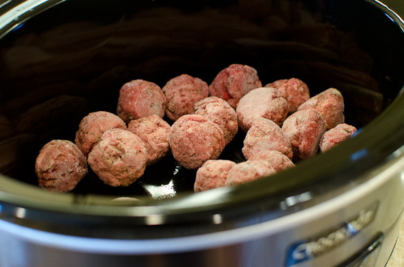 Frozen meatballs in a slow cooker.