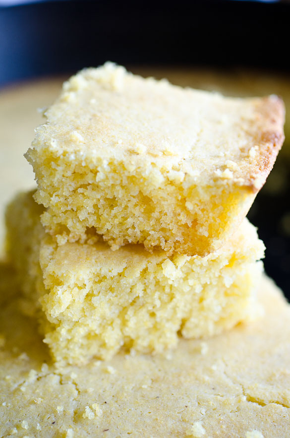 Two stacked pieces of fluffy cornbread.
