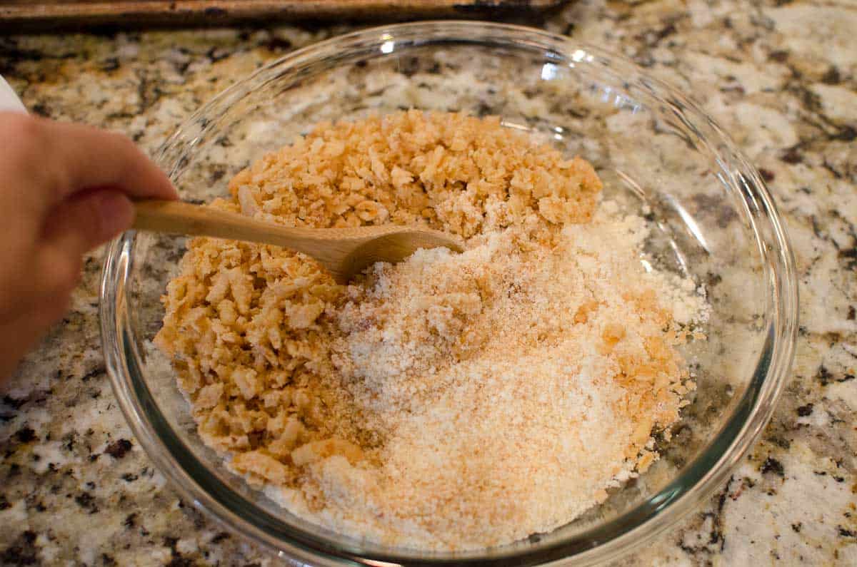 mixing bread crumbs and parmesan in shallow bowl
