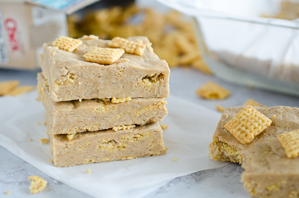 Stack of peanut butter protein bars topped with chex cereal