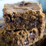 stacked chocolate pumpkin brownies with chocolate chips inside