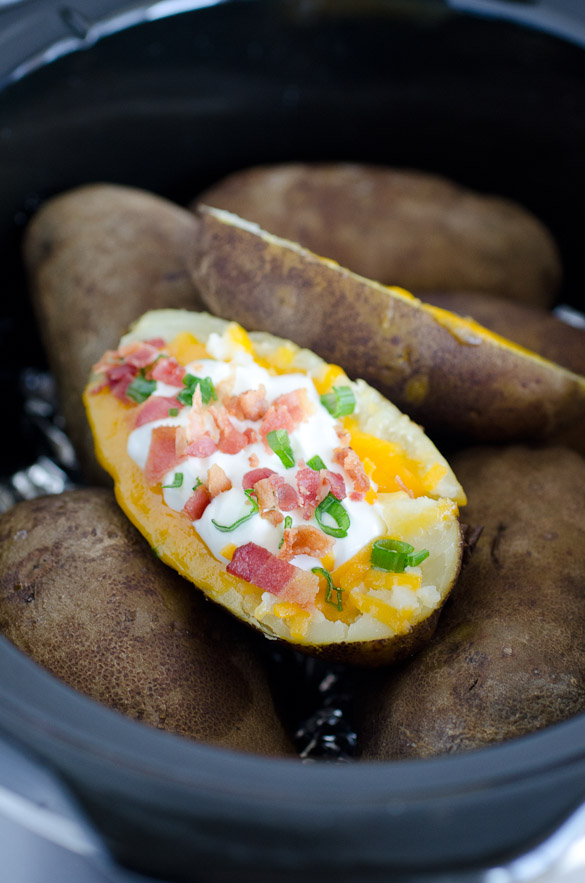 loaded baked potato with other potatoes in a crock pot