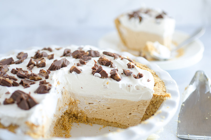 peanut butter pie with slice in background