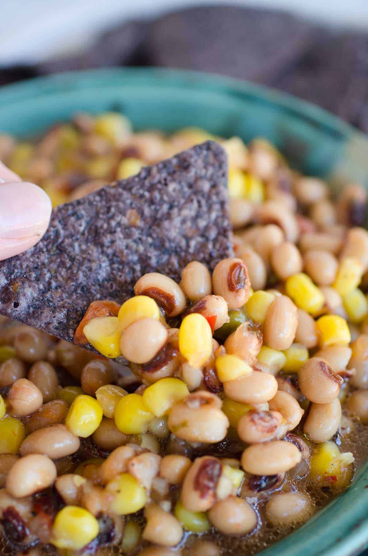 blue corn chip dipped into black eyed peas recipe