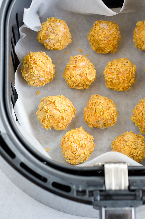 buffalo chicken cheese balls in air fryer lined with parchment paper