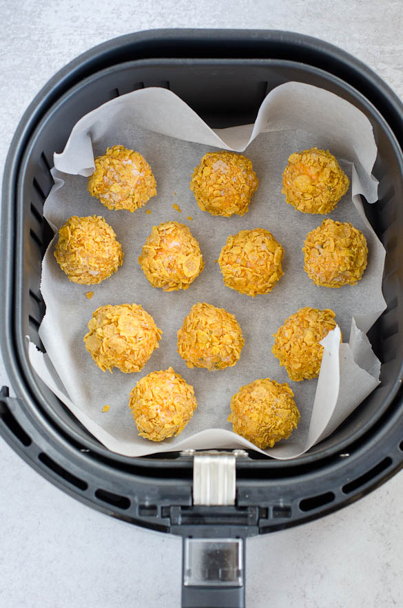 chicken bites in an air fryer basket