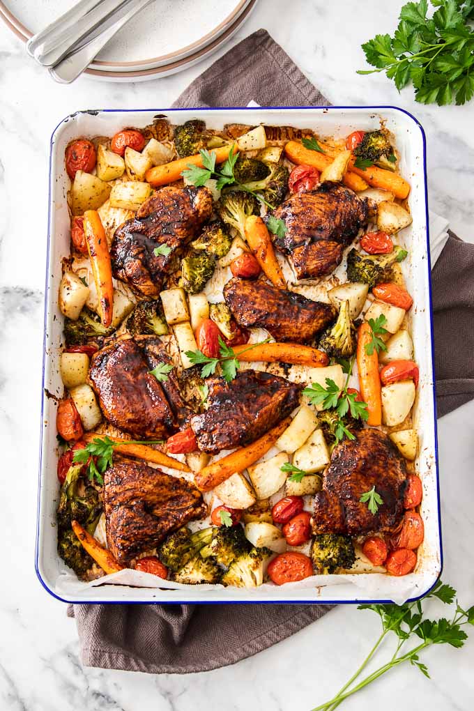chicken and veggies roasted on baking sheet