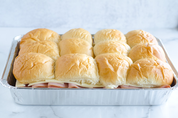 ham and cheese rolls in baking sheet