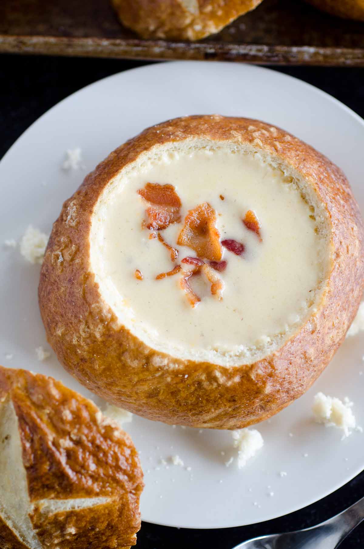 overhead view of beer cheese soup in bread bowl