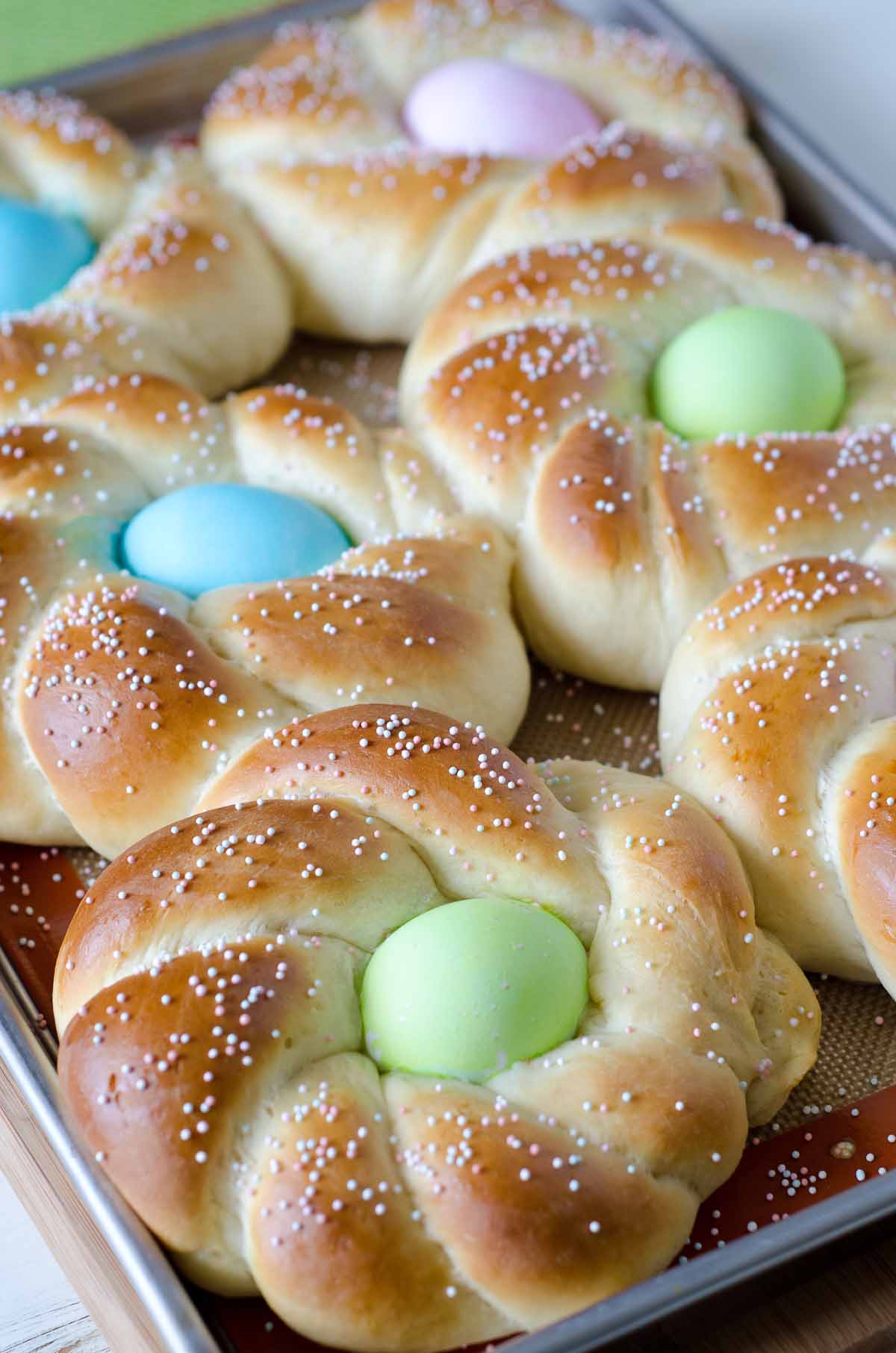 braided Italian Easter bread with dyed eggs in the center