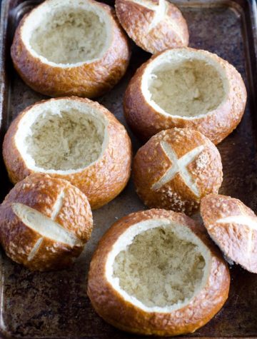 pretzel bread bowls on baking sheet