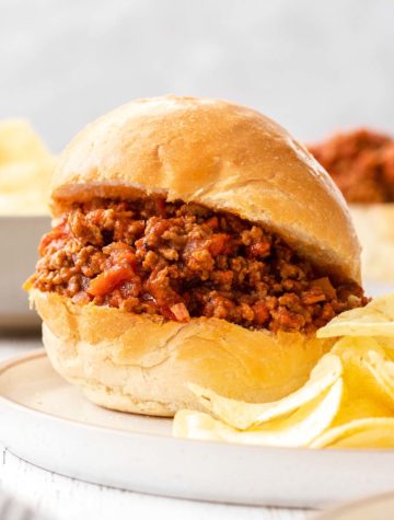 sloppy joe on a plate with chips