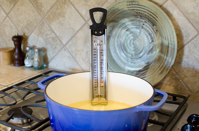 candy thermometer in dutch oven with oil