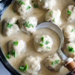 swedish meatballs in skillet with spoon