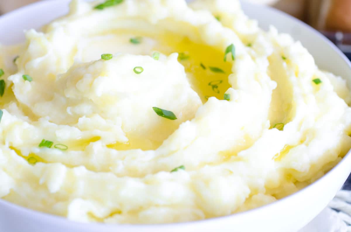 bowl of buttery mashed potatoes with chives