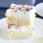 stack of two sugar cookie squares with frosting and sprinkles