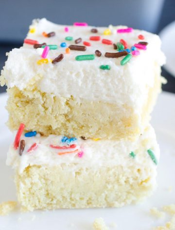 stack of two sugar cookie squares with frosting and sprinkles