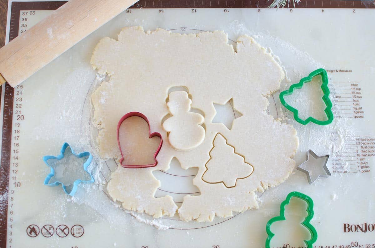 christmas cookie cut outs in sugar cookie dough