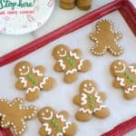 gingerbread cookies on a red baking sheet